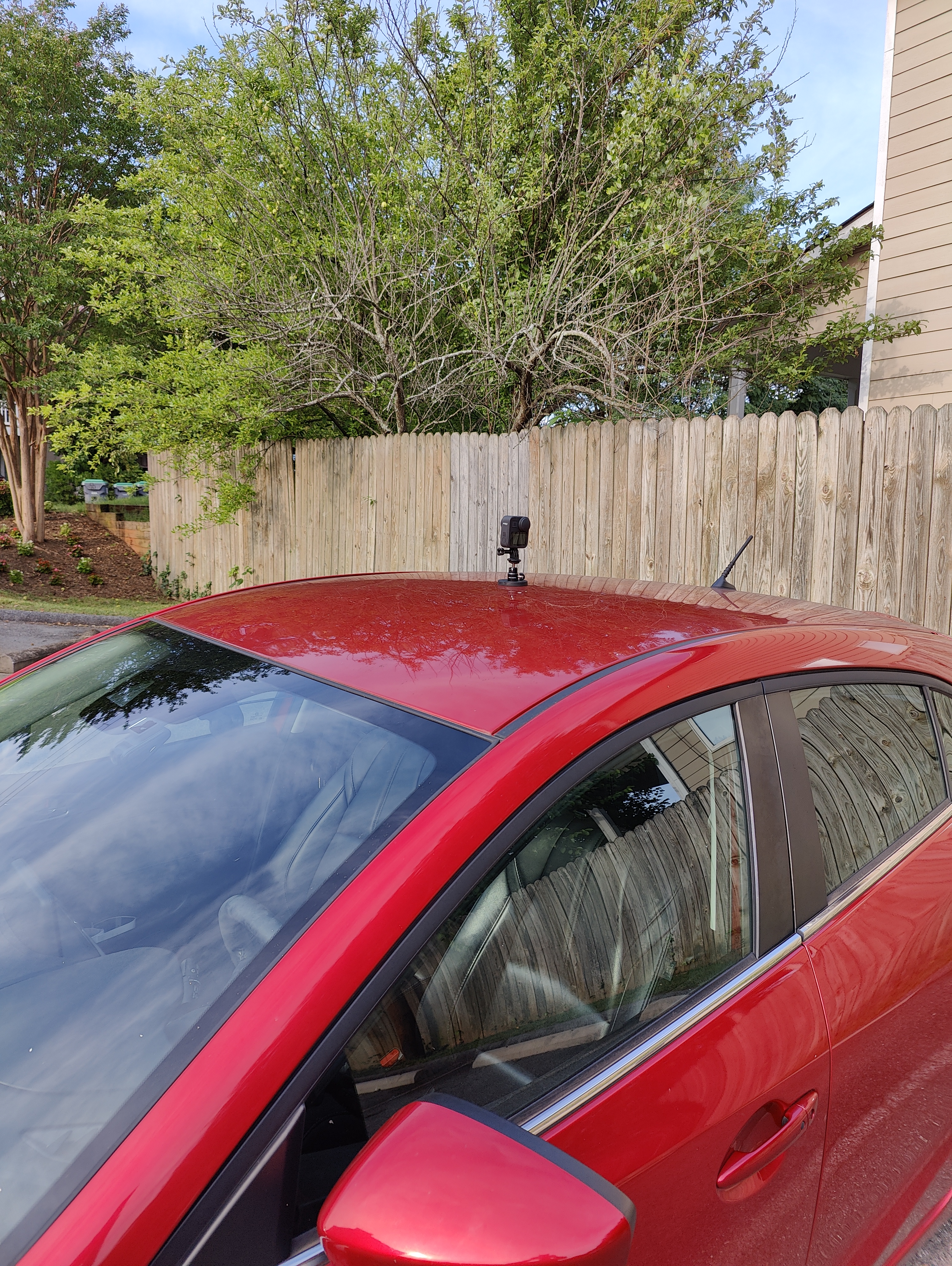 A gopro MAX mounted magnetically on my car